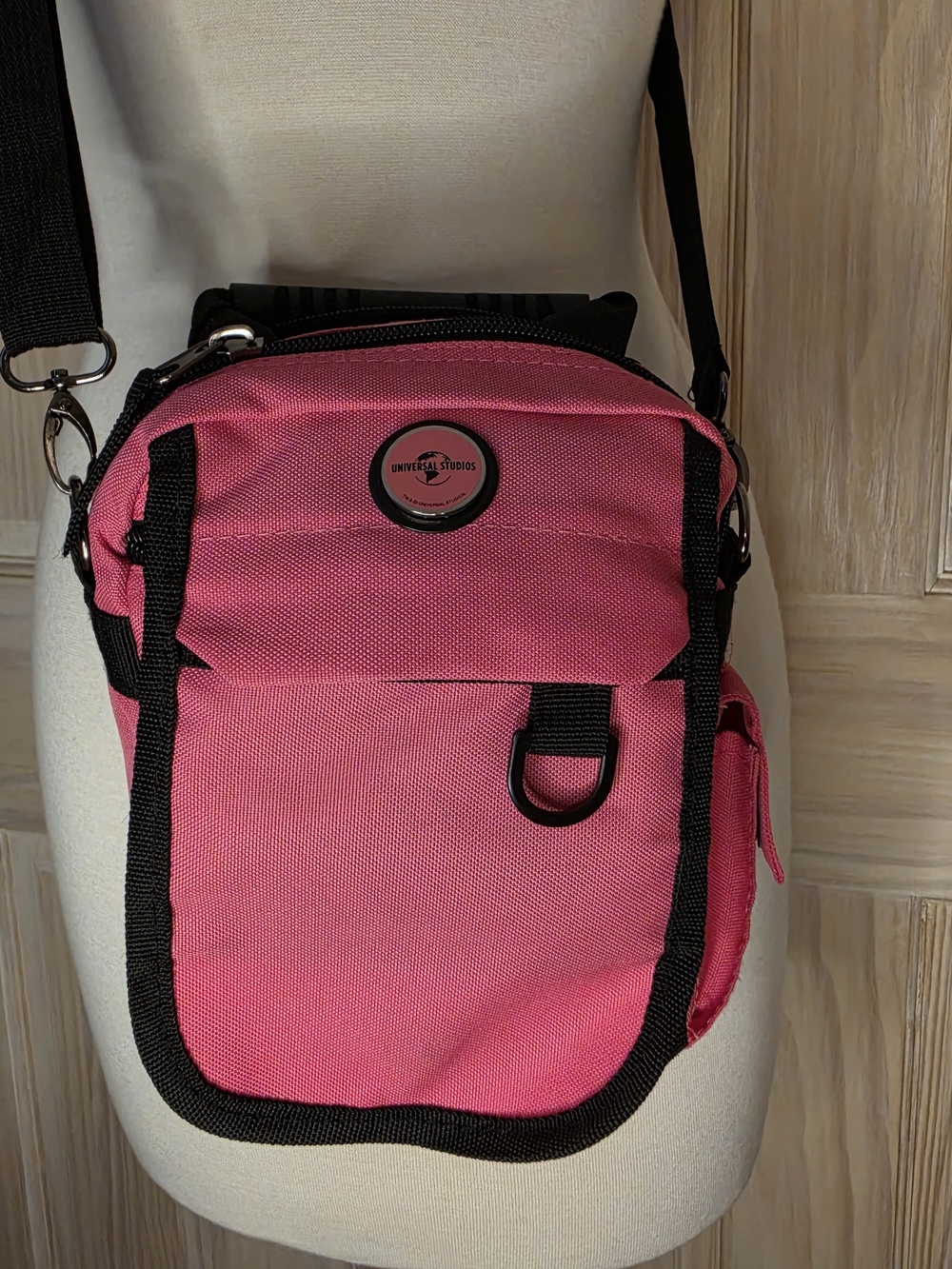 Universal Pink Crossbody Bag with Black Trim